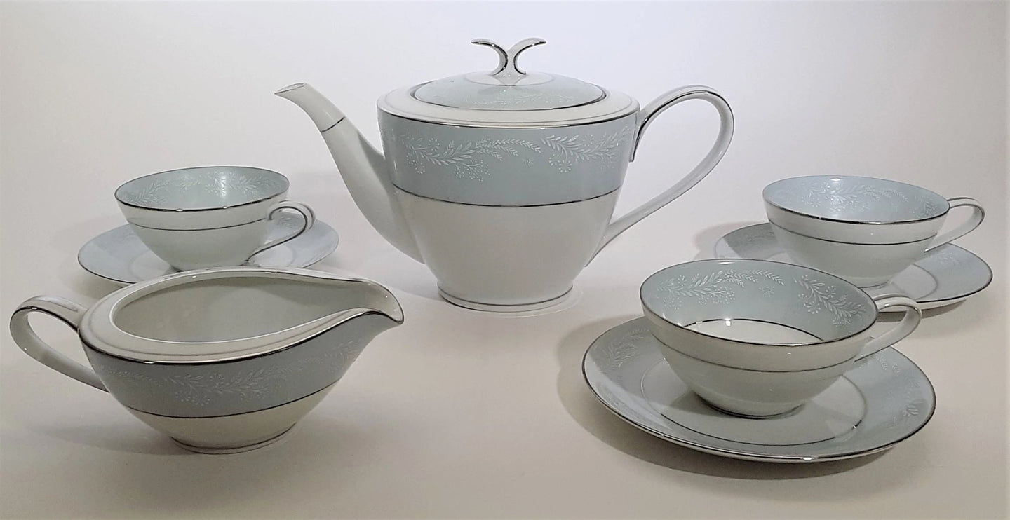 Noritake Laureate Pastel Blue Fine Porcelain 8-Piece Teapot, Teacup, Creamer Set.
