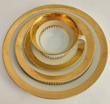 Charles Field Haviland 45-Piece Gold and Cream Rimmed Dinnerware for Seven to Ten.