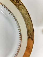 Charles Field Haviland 55-Piece Gold and Cream Rimmed Dinnerware for Seven to Ten.