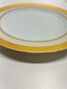 Charles Field Haviland 55-Piece Gold and Cream Rimmed Dinnerware for Seven to Ten.