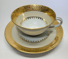 Charles Field Haviland 45-Piece Gold and Cream Rimmed Dinnerware for Seven to Ten.