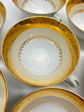 Charles Field Haviland 55-Piece Gold and Cream Rimmed Dinnerware for Seven to Ten.