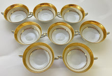 Charles Field Haviland 45-Piece Gold and Cream Rimmed Dinnerware for Seven to Ten.