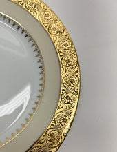 Charles Field Haviland 55-Piece Gold and Cream Rimmed Dinnerware for Seven to Ten.