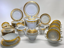 Charles Field Haviland 55-Piece Gold and Cream Rimmed Dinnerware for Seven to Ten.