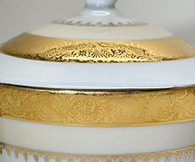 Charles Field Haviland 55-Piece Gold and Cream Rimmed Dinnerware for Seven to Ten.