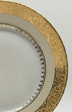 Charles Field Haviland 55-Piece Gold and Cream Rimmed Dinnerware for Seven to Ten.