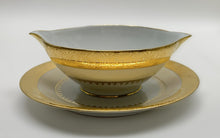 Charles Field Haviland 55-Piece Gold and Cream Rimmed Dinnerware for Seven to Ten.