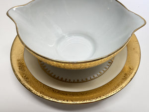 Charles Field Haviland 55-Piece Gold and Cream Rimmed Dinnerware for Seven to Ten.