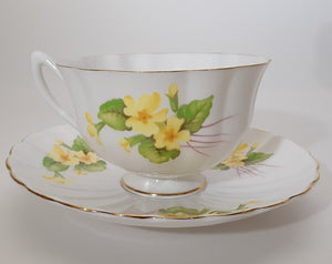Shelley Yellow Primrose English Fine Bone China Footed Teacup and Saucer Set. c. 1958-1966
