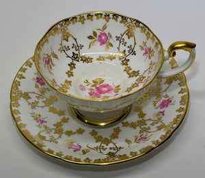 Aynsley Pink Roses and Gold Pedestal Teacup and Saucer Set. England