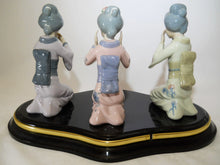 Geisha Spanish Porcelain See/ Hear/Speak No Evil Figurines on a Centerpiece Black Platform Base