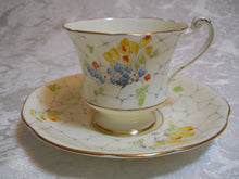 Paragon By Appointment circa 1935 "Rockery" Yellow Floral Tea Cup & Saucer
