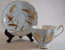 Queen Anne England Fine Bone China Light Blue and Encrusted Gold Wheat Teacup and Saucer Set.