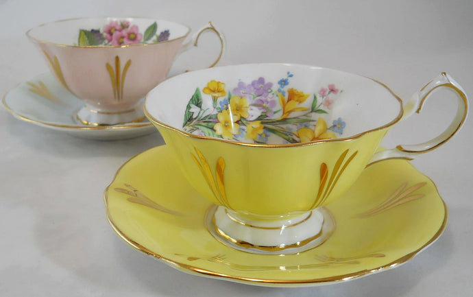 Queen Anne England Pastel Yellow, Pink, and Blue w/Gold Trim Bone China Teacup and Saucer Collection of Two. C.1959