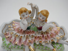 Ruffled Dress Girls On Couch 7" Porcelain Figurine