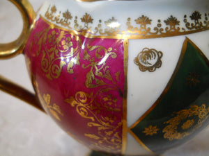 Oscar Schlegelmilch Porcelain Red/ Green/ Gilt Ornamental Coffee Service with Seven Demitasse Cup/ Saucer Sets, 1900-1957