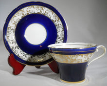 Aynsley Cobalt Blue and Cream with Gold Trim Bone China Teacup/Saucer Set, England, c.1934.