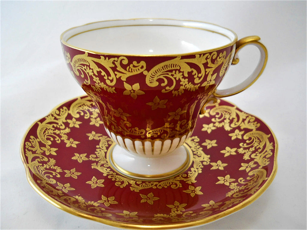 EB Foley England Maroon and Gold Gilt Corset Shaped Bone China Teacup and Saucer Pair. 1948-1963.