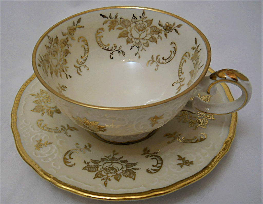 Zeh Scherzer & Co. Bavaria Ivory and Gold Porcelain Teacup and Saucer Pair. 