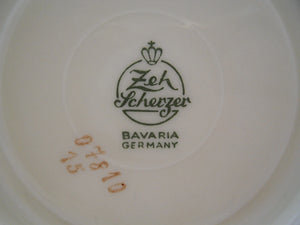 Zeh Scherzer & Co. Bavaria Ivory and Gold Porcelain Teacup and Saucer Pair.